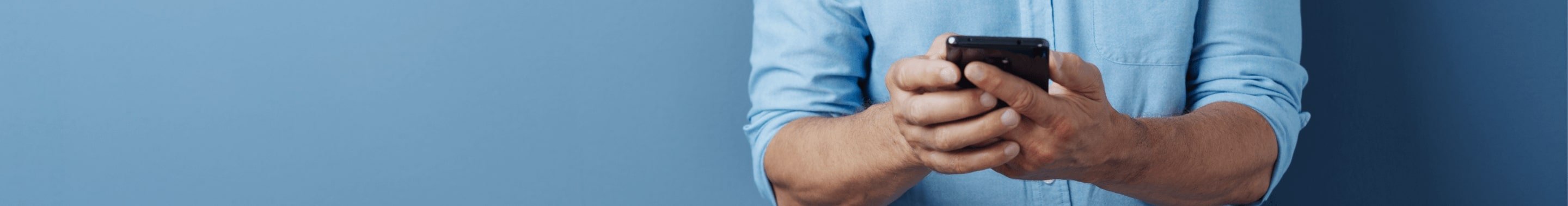 Close-up image of two hands holding a smartphone