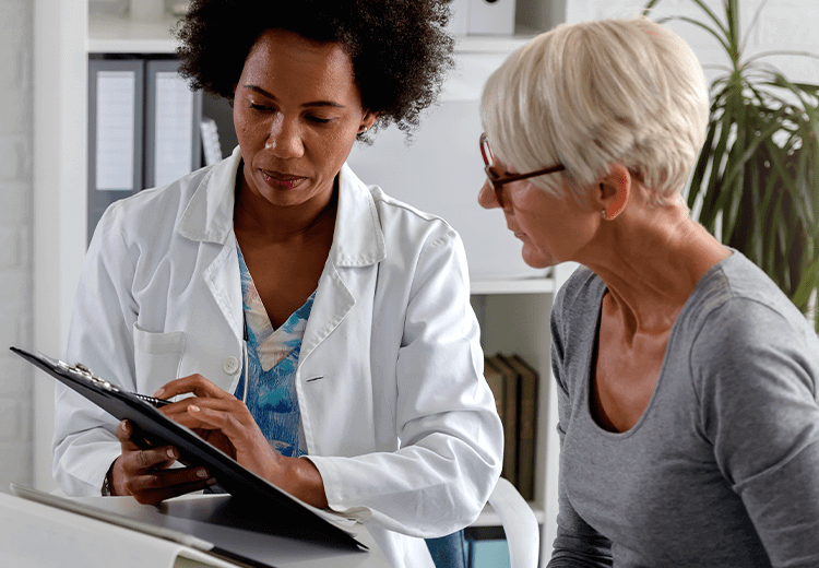 Female doctor talking to a female patient