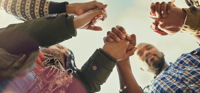 Image of people in a circle holding hands