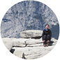 Image of person sitting on a rock