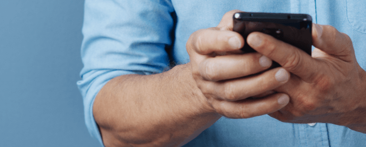 Close-up image of two hands holding a smartphone